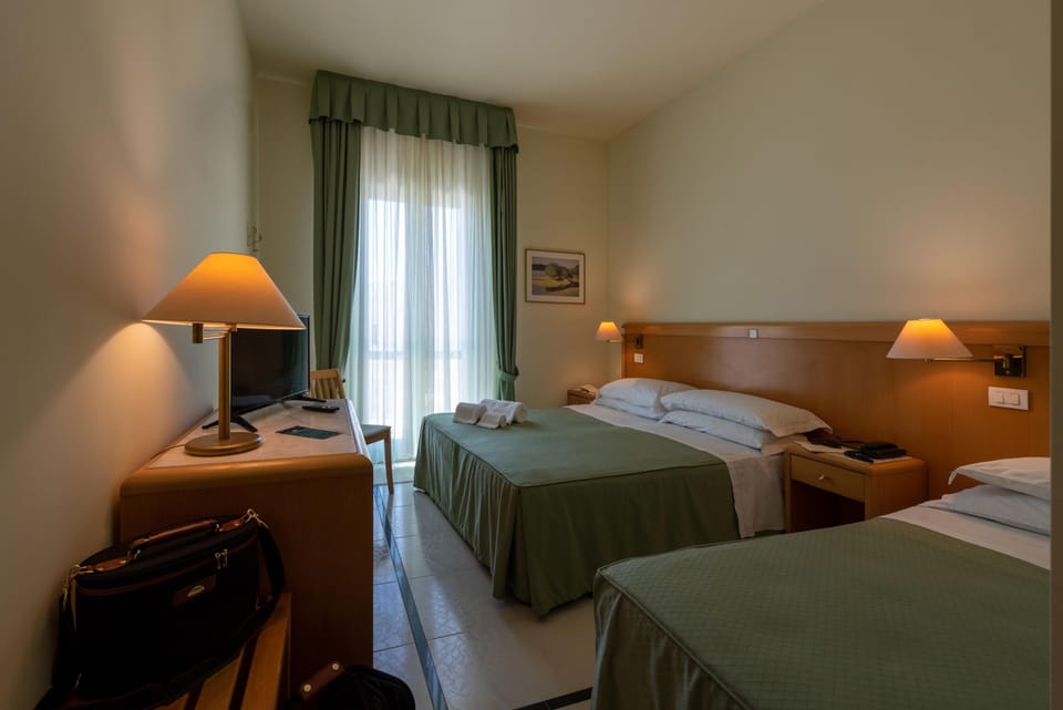 Superior Triple Room, Sea View | Minibar, in-room safe, desk, soundproofing