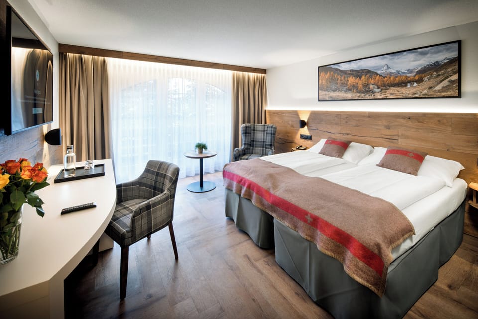 Deluxe Triple Room, Mountain View | Premium bedding, in-room safe, desk, blackout drapes