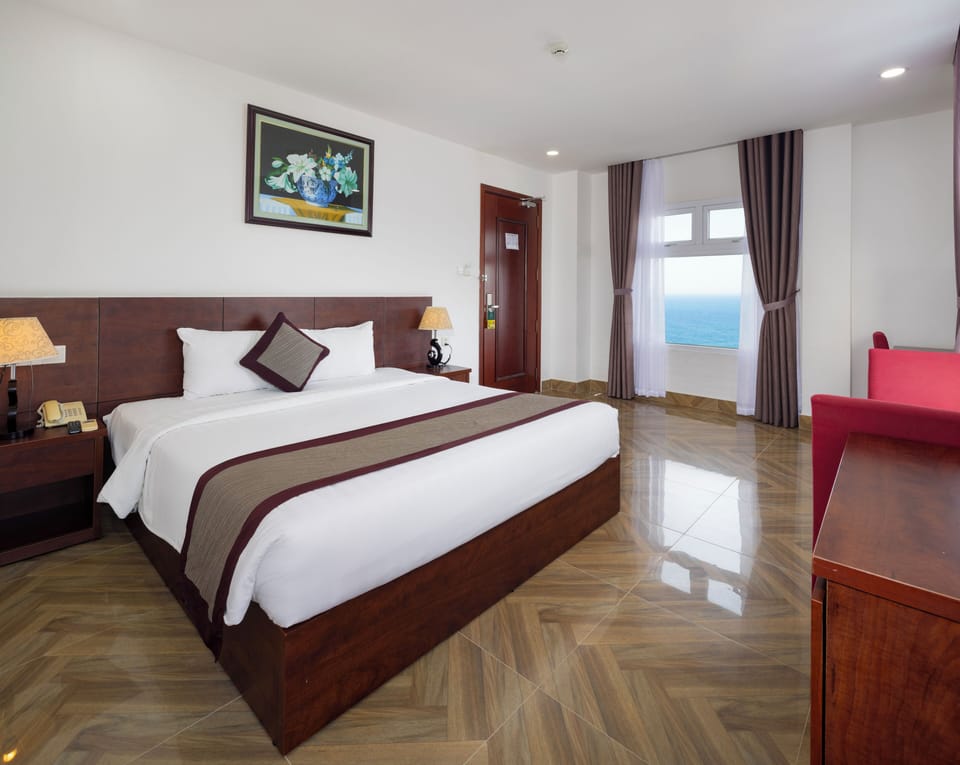 Deluxe Double Room, Sea View | Premium bedding, minibar, in-room safe, desk
