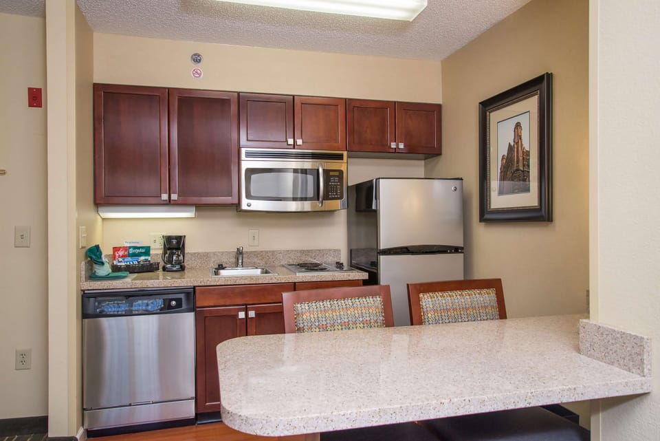 Suite, 1 King Bed | Private kitchen | Fridge, microwave, stovetop, dishwasher
