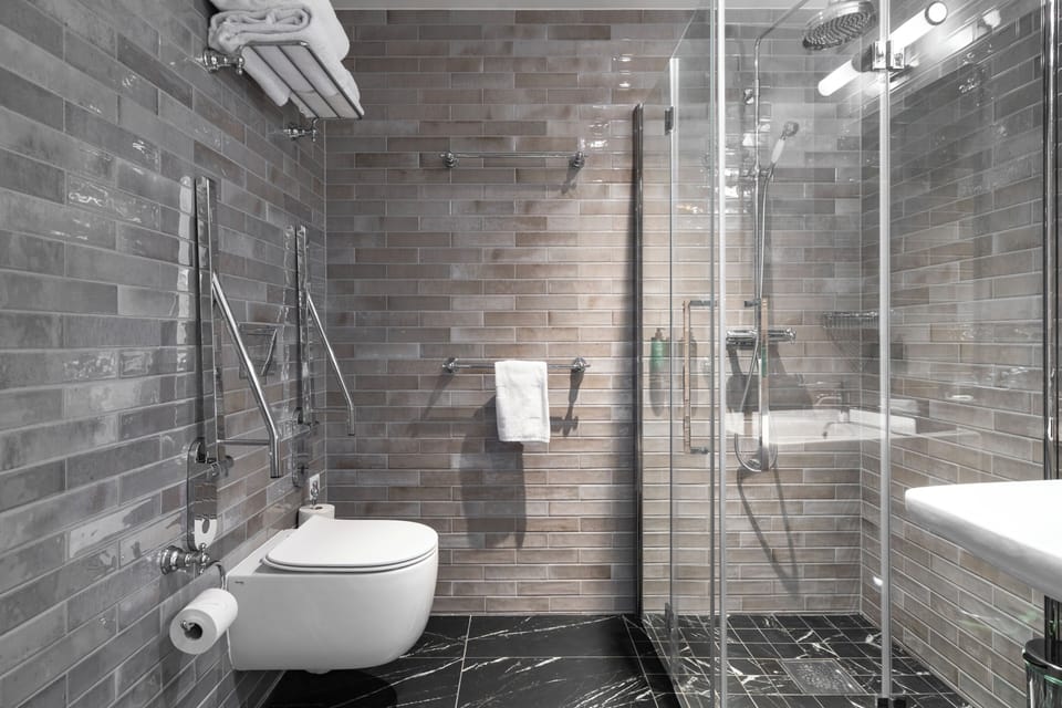Junior Suite, Non Smoking | Bathroom | Shower, hair dryer, bathrobes, slippers