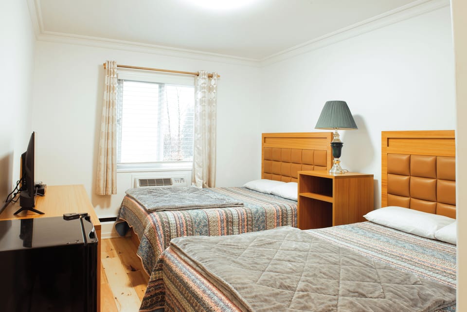 Basic Room, 2 Double Beds | Desk, cribs (free), WiFi (free), bed sheets