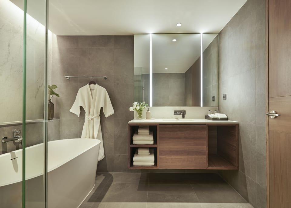 Two Bedroom Signature Suite | Bathroom | Separate tub and shower, hydromassage showerhead, free toiletries
