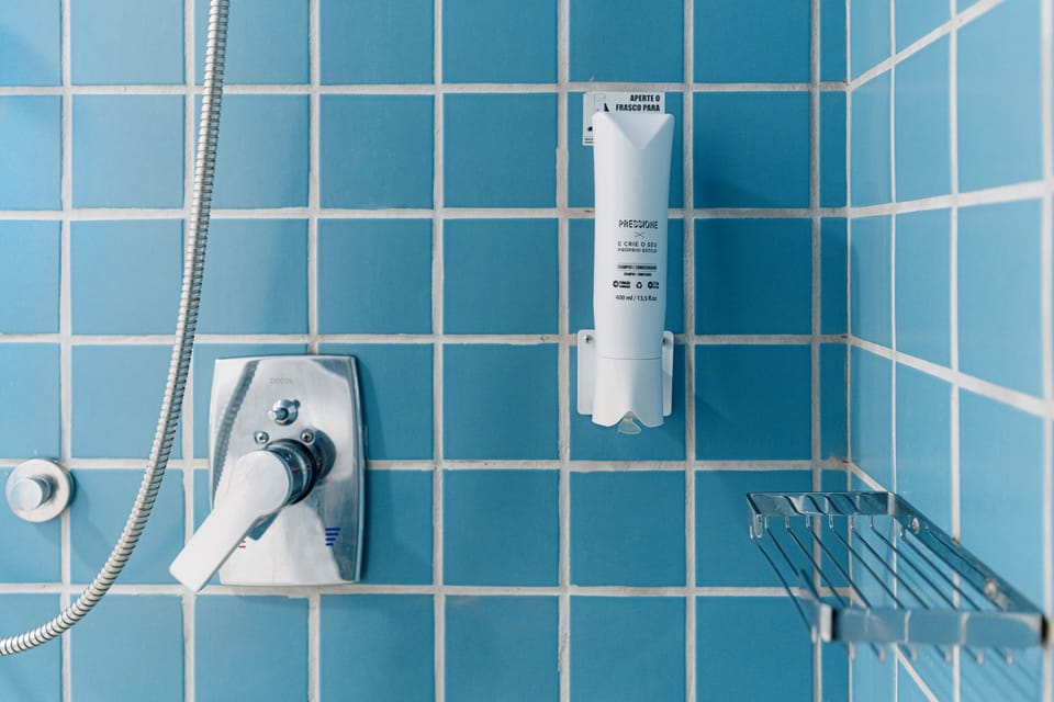 Shower, eco-friendly toiletries, hair dryer, towels