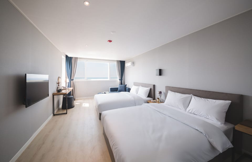 Deluxe Room, 2 Double Beds, Non Smoking, Sea View | 1 bedroom, down comforters, desk, blackout drapes