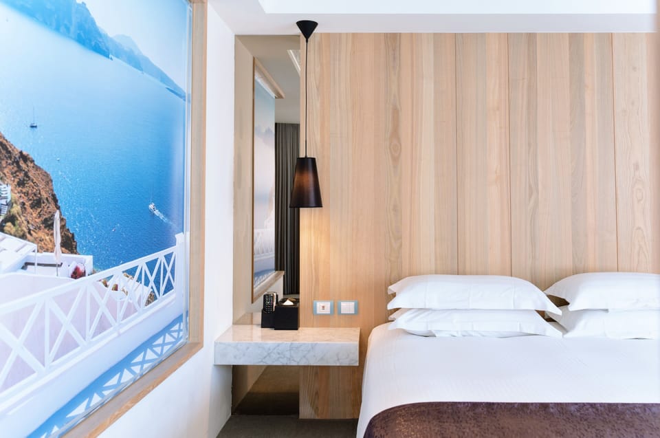 Premium bedding, desk, laptop workspace, blackout drapes