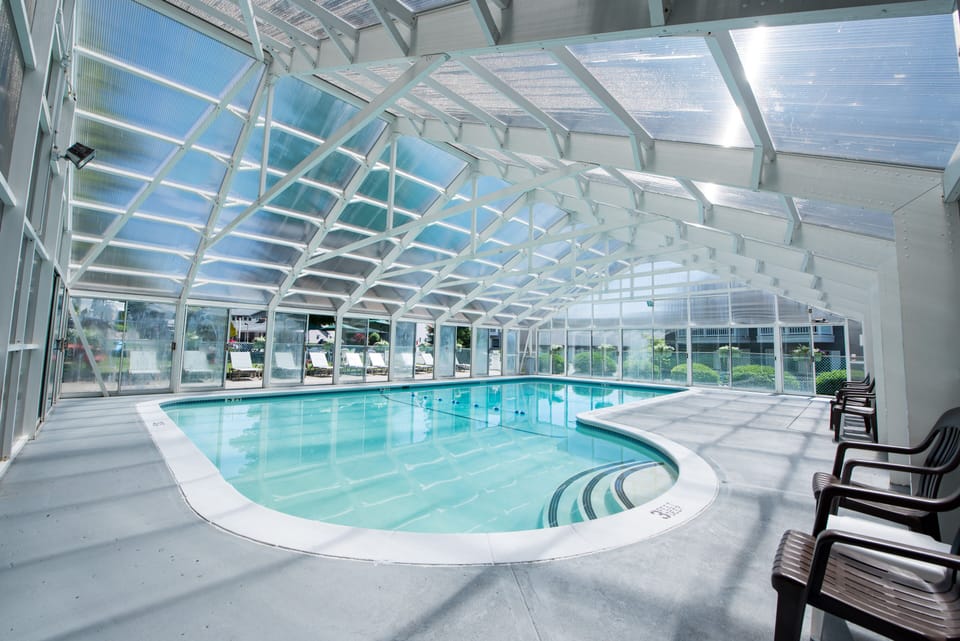 Indoor pool, outdoor pool, open 9:00 AM to 10:00 PM, pool umbrellas