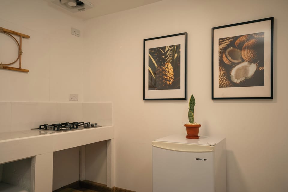 Family Rooms with Kitchenette | Private kitchen | Fridge, coffee/tea maker, electric kettle