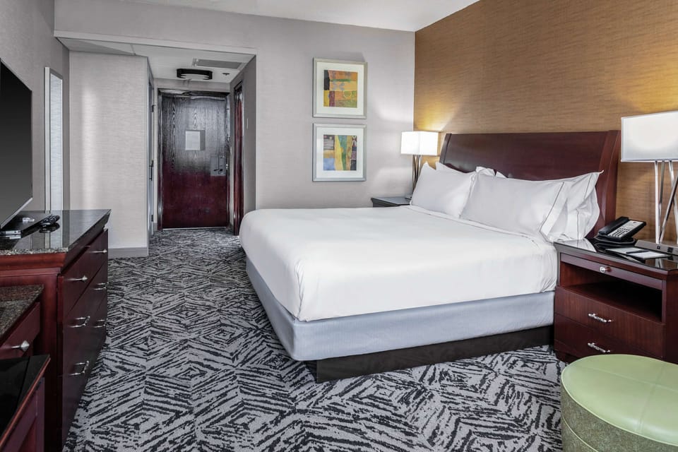 Premium bedding, desk, laptop workspace, iron/ironing board