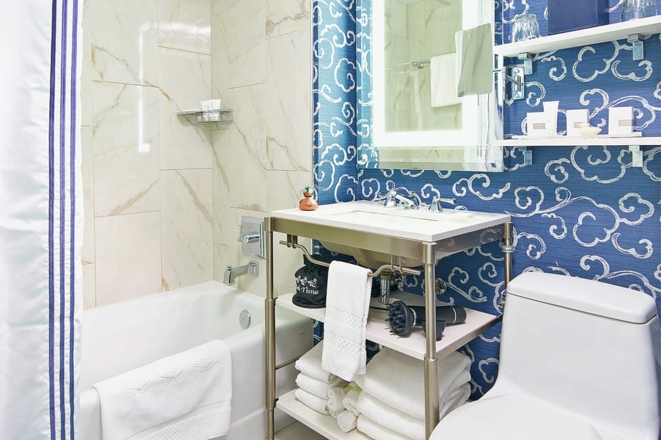 Combined shower/tub, hair dryer, towels, soap