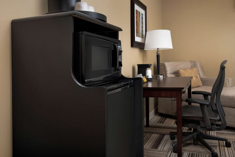 Desk, laptop workspace, blackout drapes, iron/ironing board