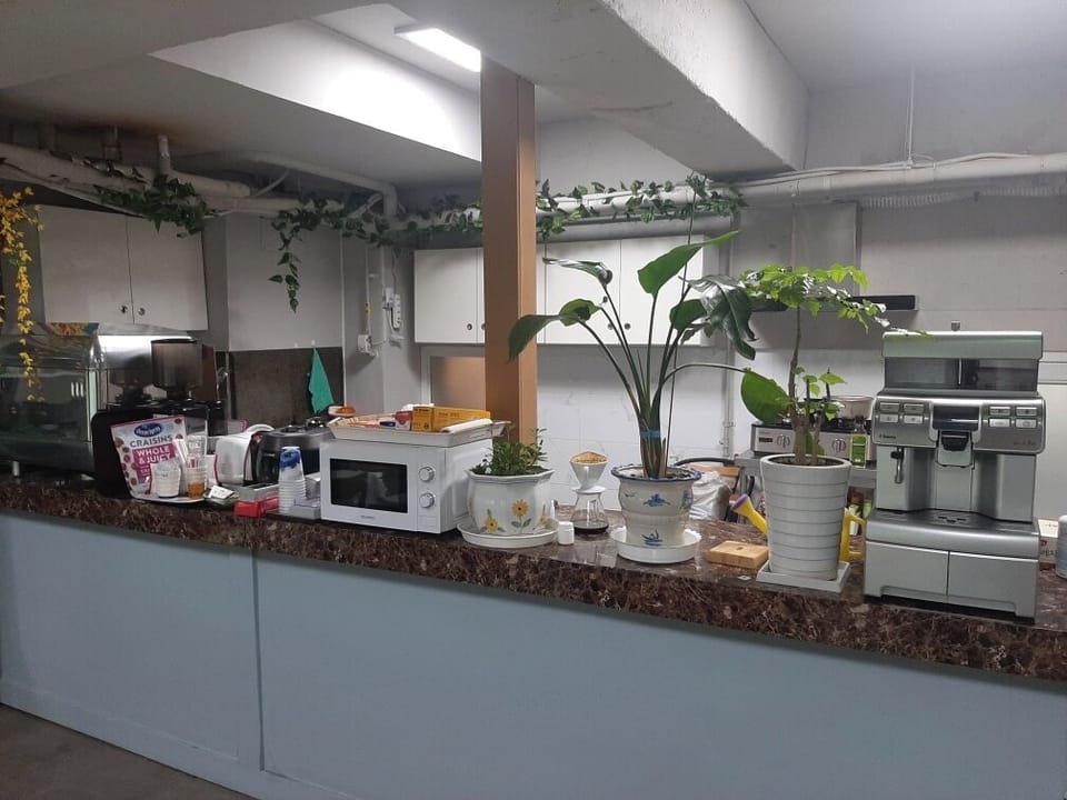 Mini-fridge, microwave, electric kettle, toaster
