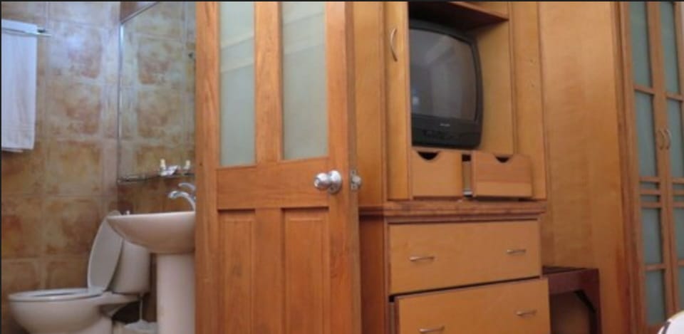 Economy Room, 1 Double Bed | Bathroom | Shower, hair dryer, towels