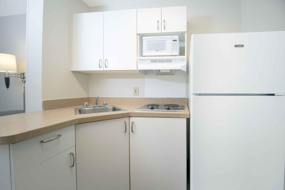 Full-size fridge, microwave, stovetop, coffee/tea maker