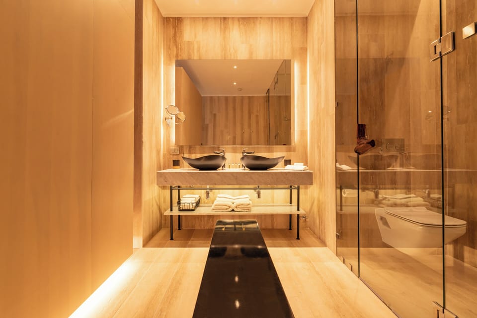 Signature Suite (Magnolia) | Bathroom | Shower, hair dryer, bathrobes, towels