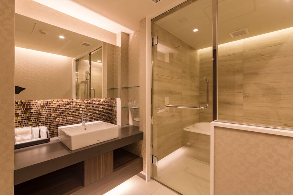 Separate tub and shower, free toiletries, hair dryer, slippers