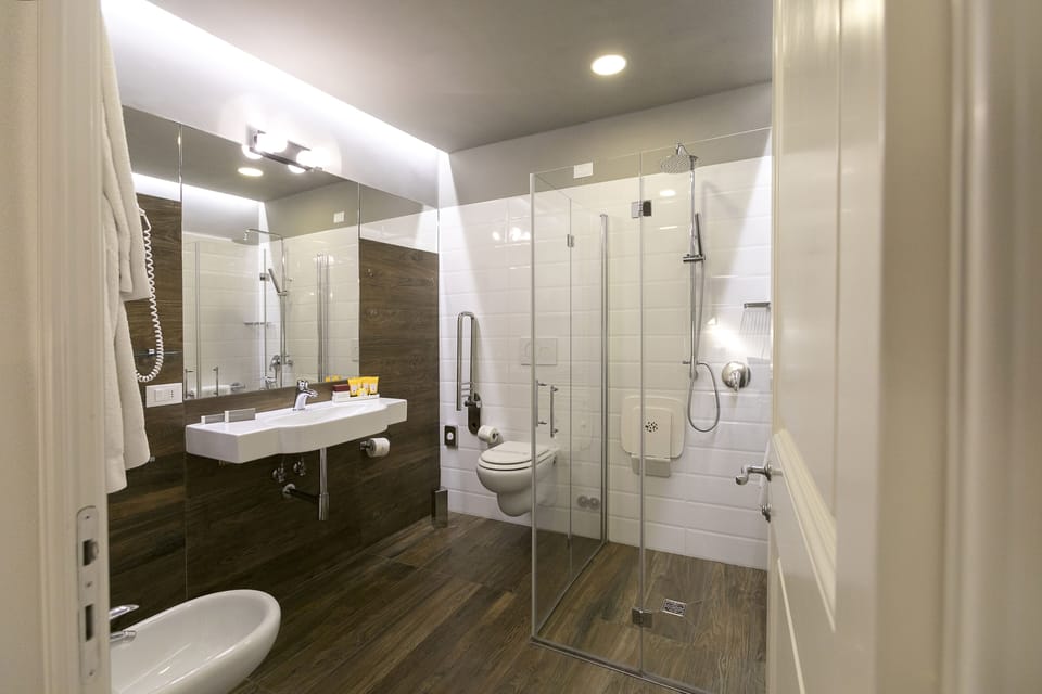 Shower, free toiletries, hair dryer, slippers