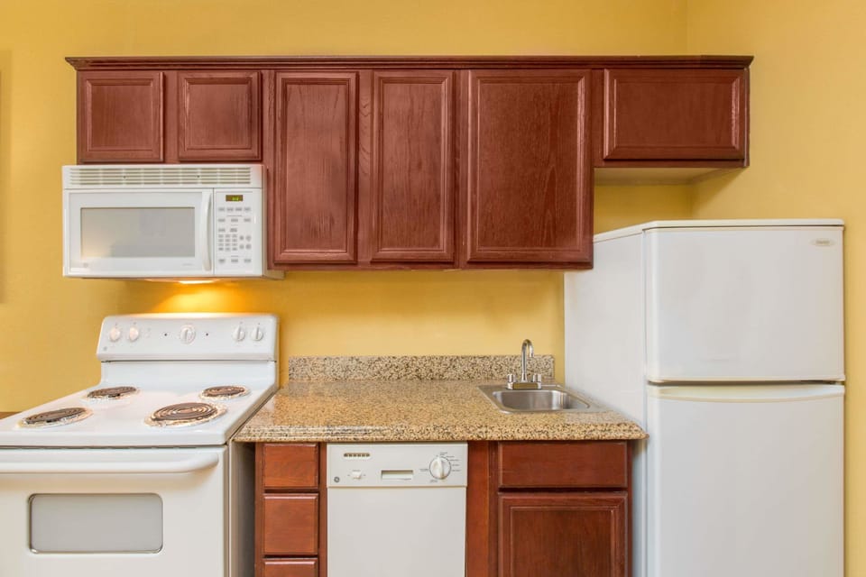 Coffee/tea maker, fridge, microwave, cookware/dishes/utensils