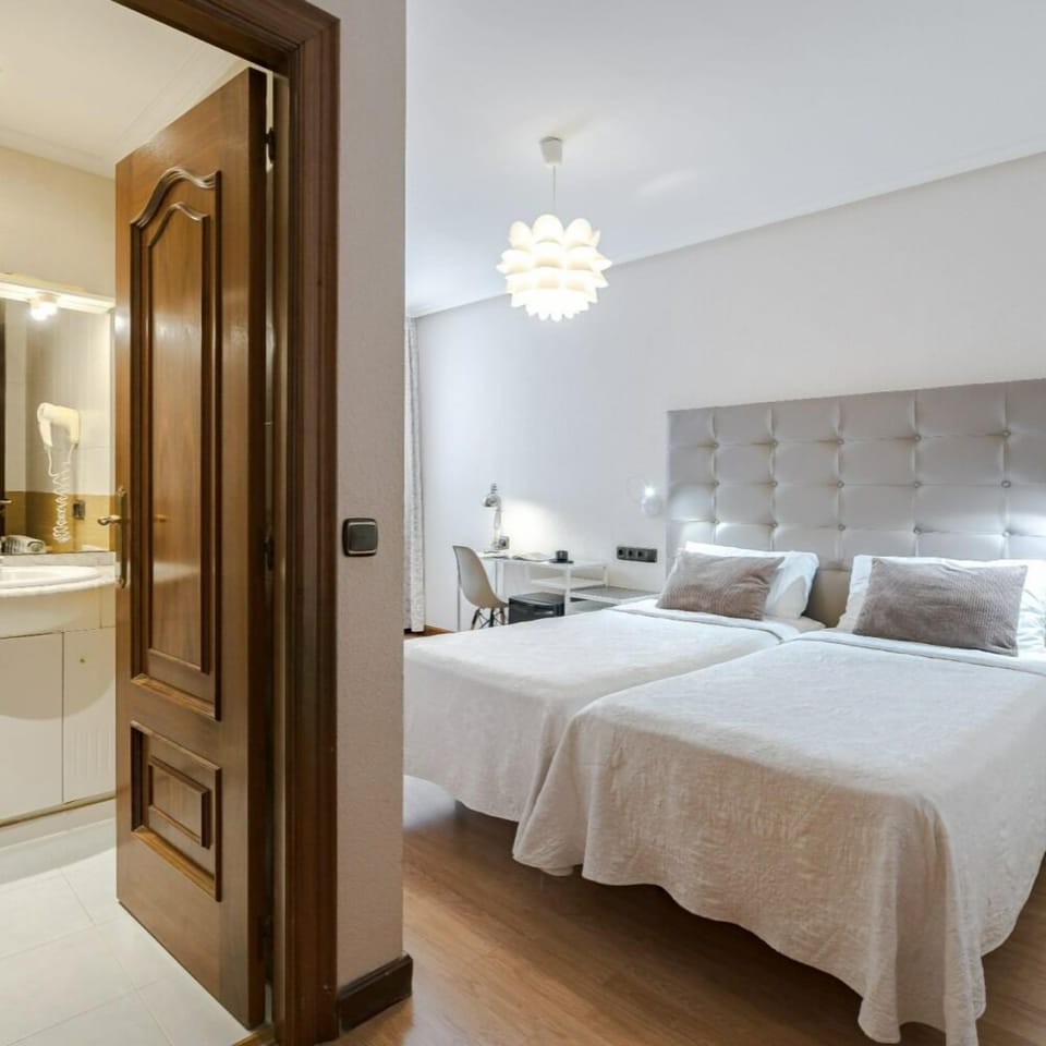 Standard Double Room | Minibar, in-room safe, blackout drapes, iron/ironing board