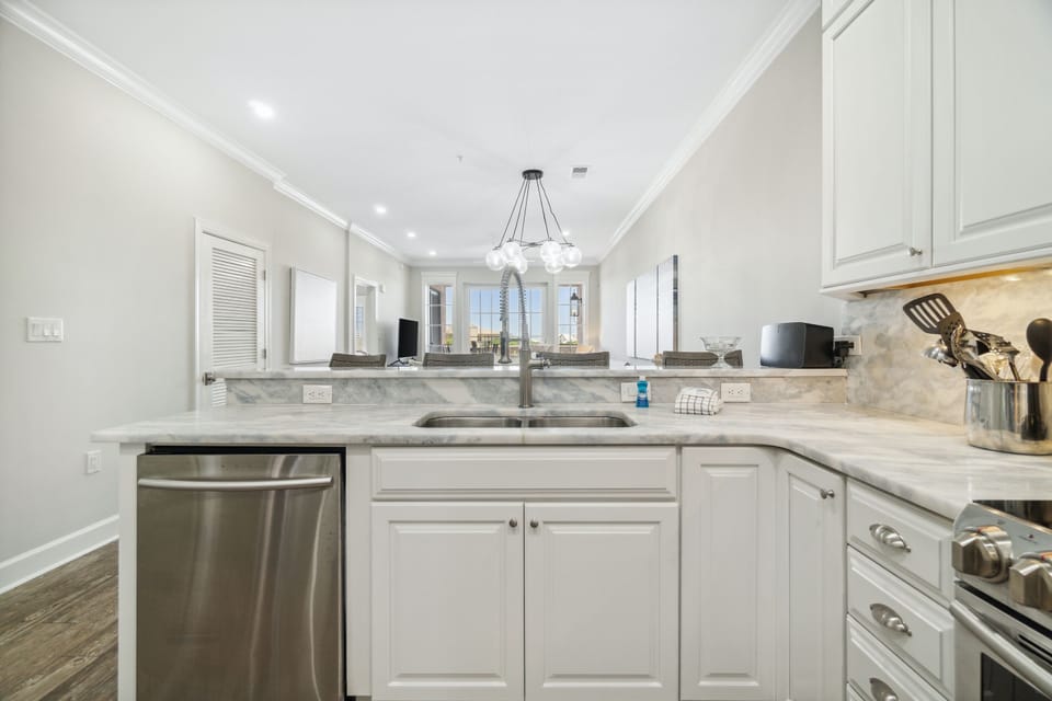 Condo, 3 Bedrooms (E302) | Private kitchen | Microwave, coffee/tea maker, toaster, cookware/dishes/utensils