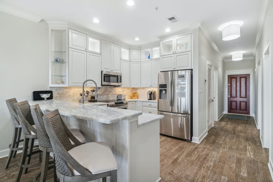 Condo, 3 Bedrooms (E302) | Private kitchen | Microwave, coffee/tea maker, toaster, cookware/dishes/utensils