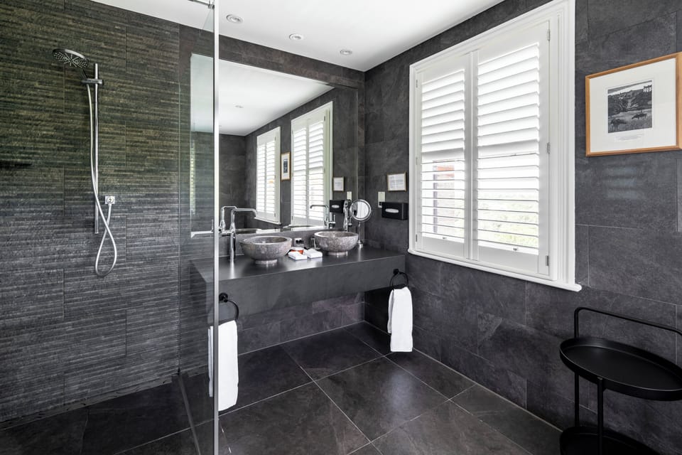 Signature Duplex, 1 King Bed | Bathroom | Combined shower/tub, free toiletries, hair dryer, towels