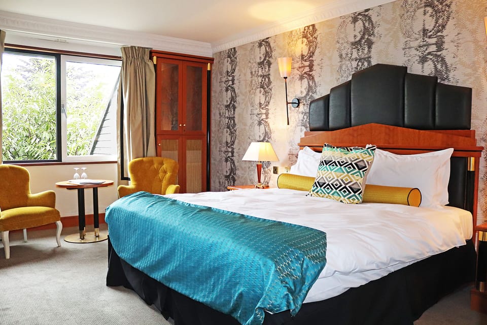 Executive Double Room | Minibar, individually decorated, desk, laptop workspace