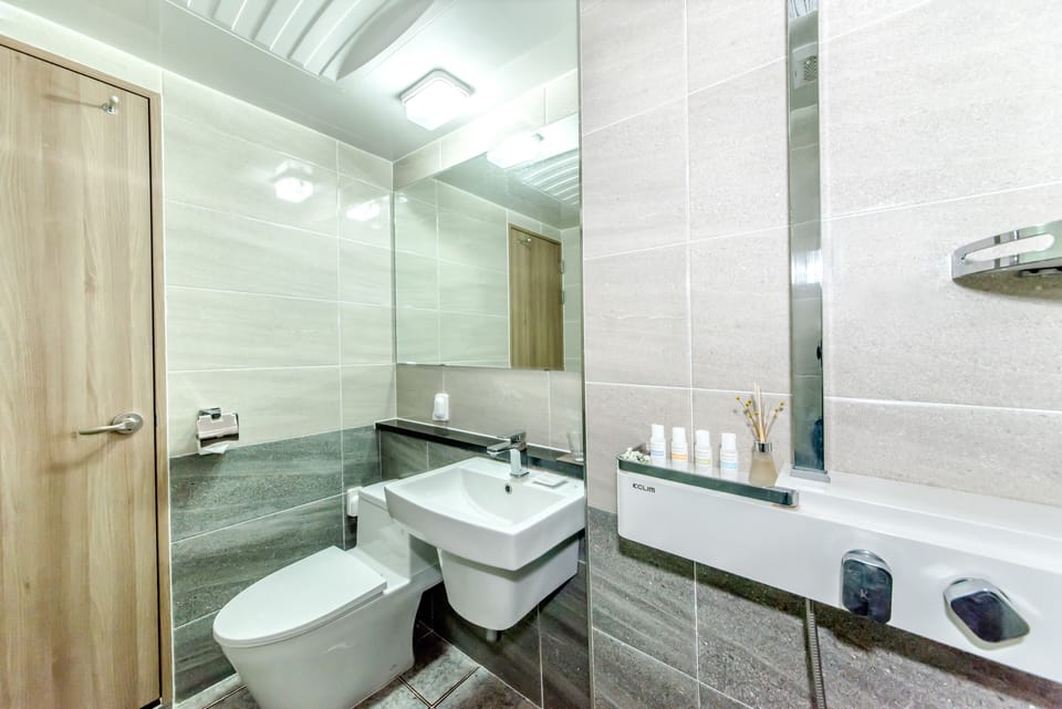 Shower, designer toiletries, hair dryer, slippers