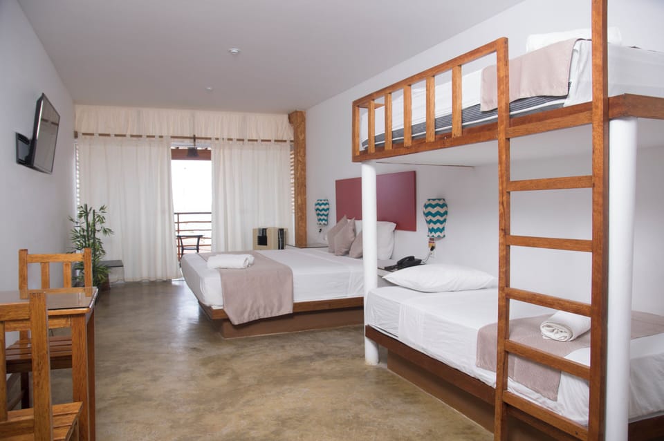 Family Room, Ocean View | Minibar, in-room safe, desk, iron/ironing board (on request)