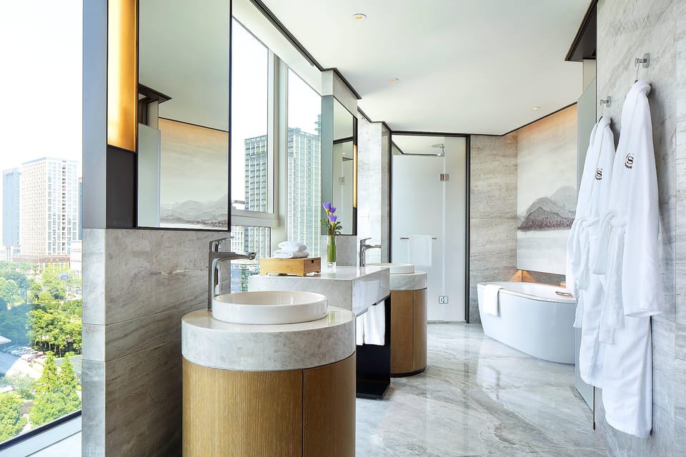 Club Suite, 1 King Bed, River View, Corner | Bathroom | Separate tub and shower, rainfall showerhead, hair dryer, bathrobes
