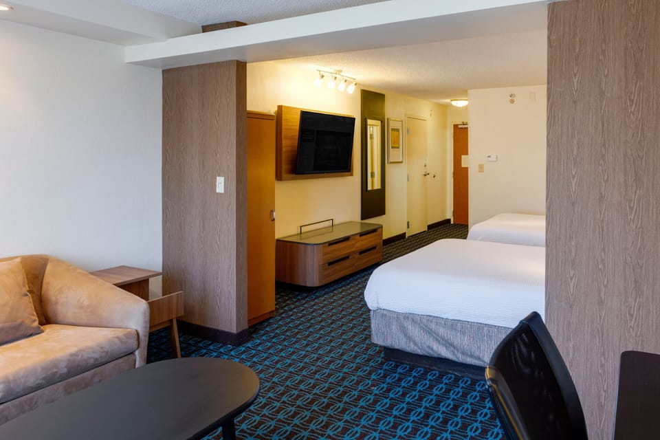 Suite, Multiple Beds | Premium bedding, desk, blackout drapes, iron/ironing board