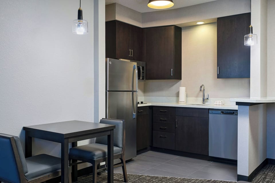 Fridge, microwave, coffee/tea maker, cookware/dishes/utensils
