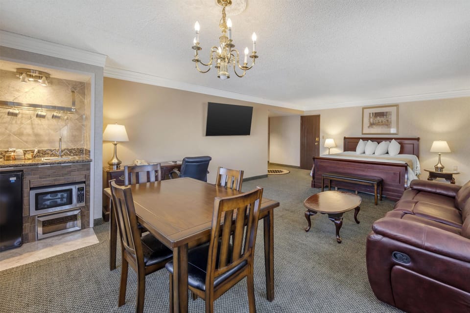 Suite, 1 King Bed, Non Smoking, Refrigerator & Microwave (Larger Room) | Premium bedding, blackout drapes, iron/ironing board