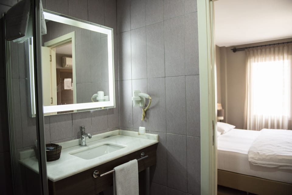 Shower, free toiletries, hair dryer, slippers