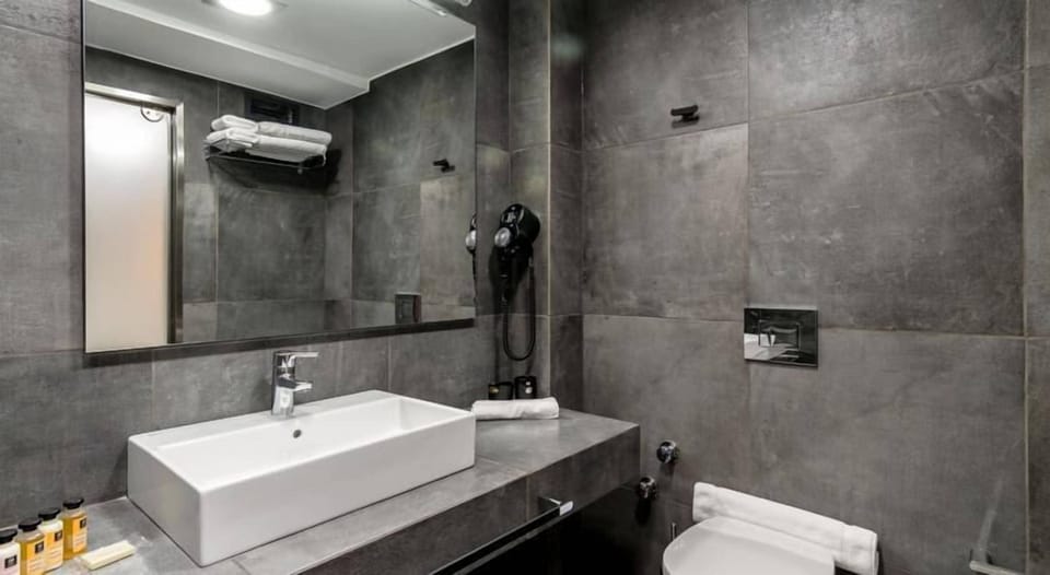 Shower, designer toiletries, hair dryer, bathrobes