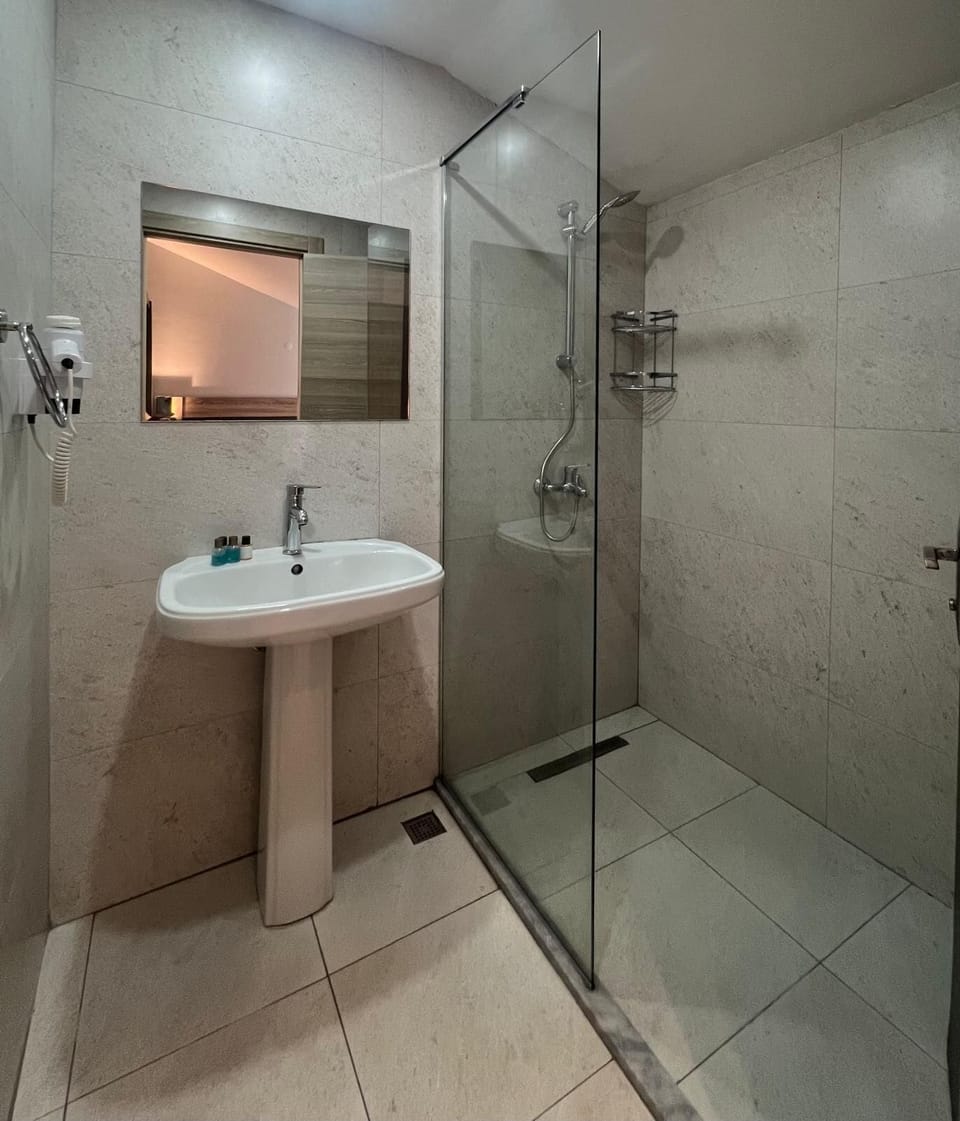 Economy Double or Twin Room | Bathroom | Shower, hair dryer, slippers, towels