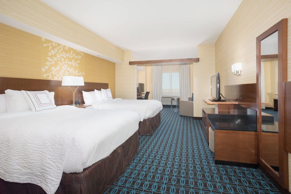 Suite, Multiple Beds | Desk, laptop workspace, blackout drapes, iron/ironing board