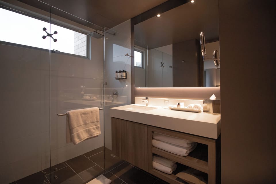 Designer toiletries, hair dryer, bathrobes, towels