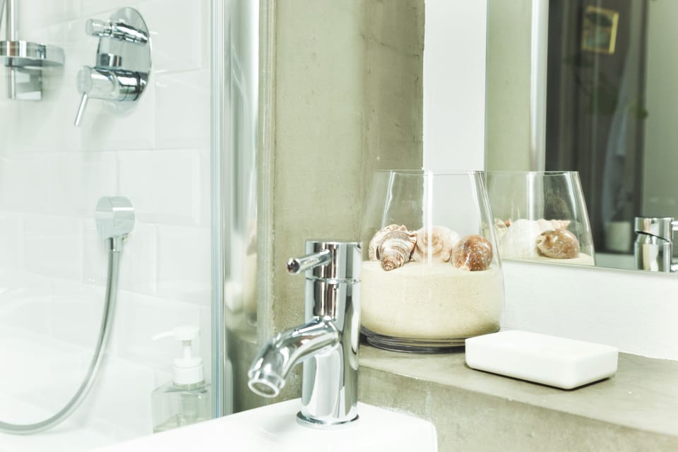 Deluxe Room | Bathroom | Designer toiletries, hair dryer, towels