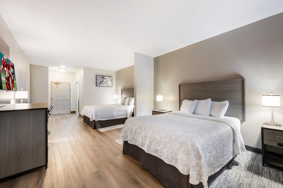 Deluxe Room, 2 Queen Beds (Smoke Free) | Desk, laptop workspace, blackout drapes, iron/ironing board