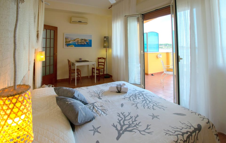 Apartment, Kitchen, Sea View | Desk, soundproofing, iron/ironing board, free cribs/infant beds