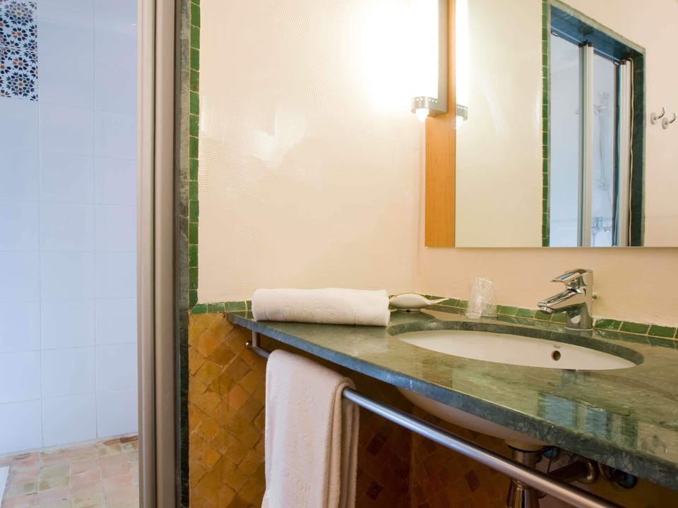 Shower, eco-friendly toiletries, hair dryer, towels