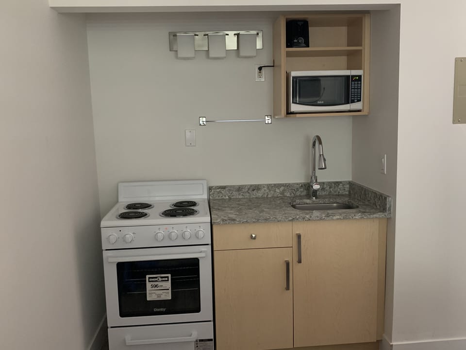 Basic Room, 2 Double Beds, Kitchenette | Bathroom | Combined shower/tub, free toiletries, hair dryer, towels