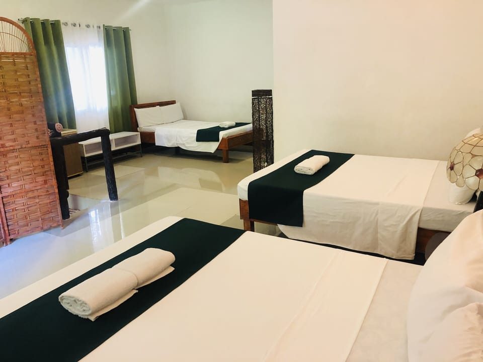 Family Quadruple Room | Individually furnished, desk, laptop workspace, blackout drapes