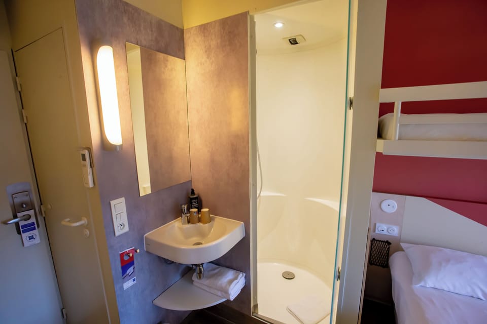 Triple Room, Multiple Beds | Bathroom | Shower, eco-friendly toiletries, hair dryer, towels