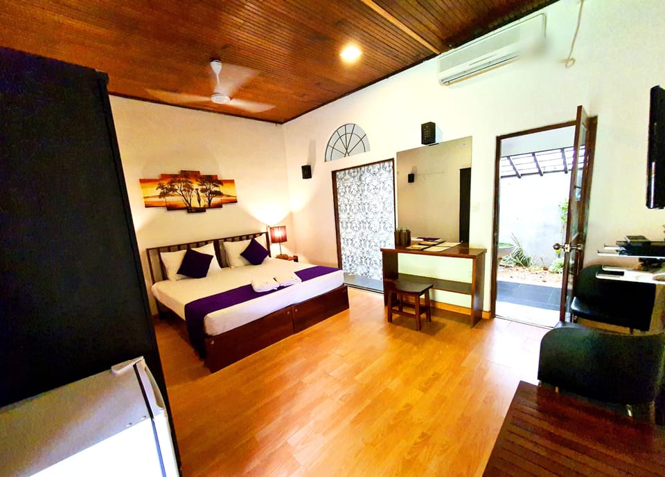 Deluxe Room, Private Bathroom, Garden View | In-room safe, desk, soundproofing, iron/ironing board