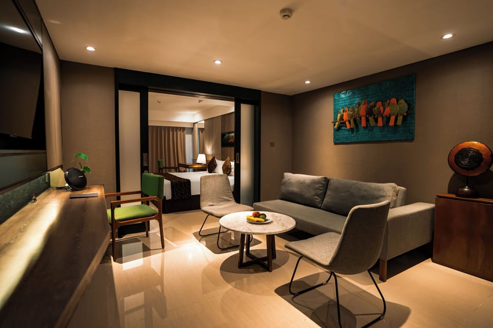 Executive Suite Room with Balcony | Living area | 42-inch flat-screen TV with cable channels, TV