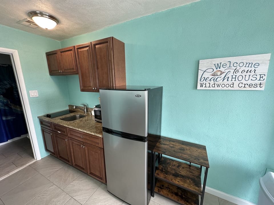 Coffee/tea maker, full-size fridge, microwave, cookware/dishes/utensils