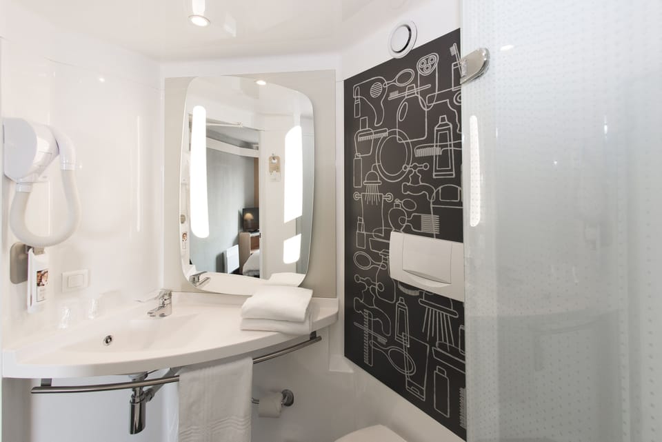 Shower, eco-friendly toiletries, hair dryer, towels