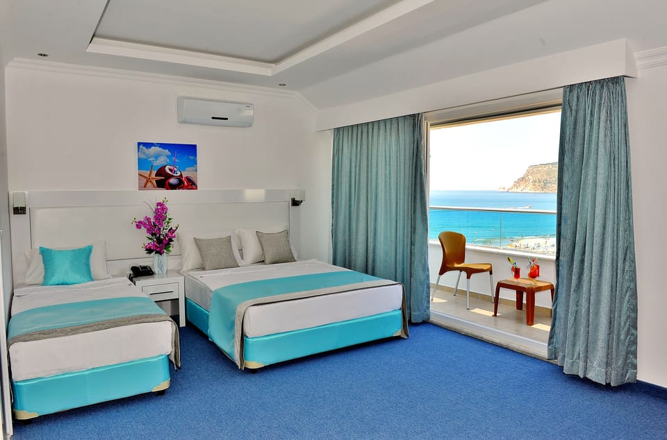 Standard Triple Room | Desk, soundproofing, iron/ironing board (on request), bed sheets